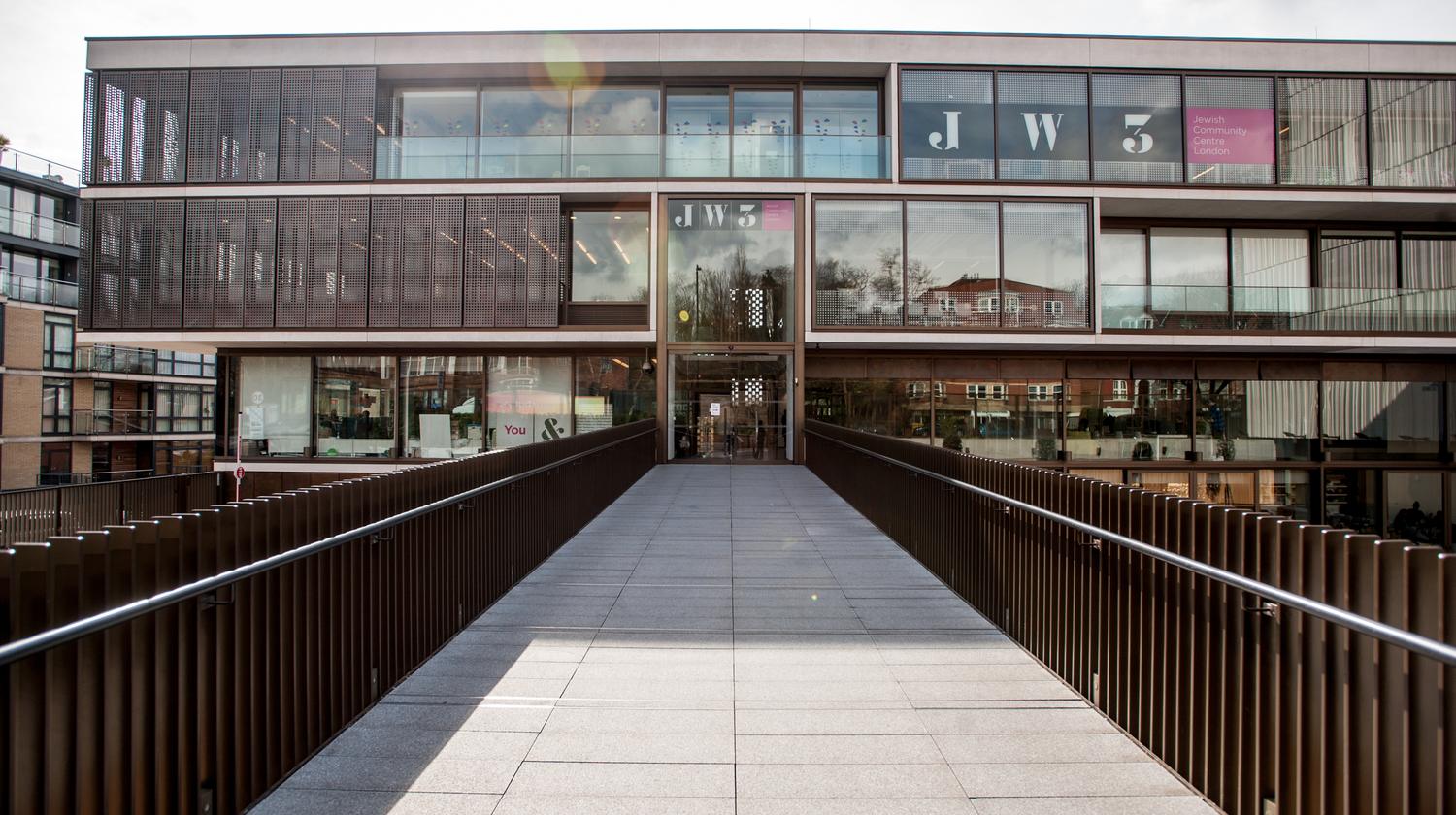 The pedestrian bridge from Finchley Road leading across the sunken piazza to JW3's main entrance.