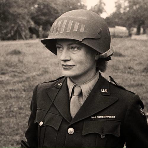 Lee Miller in steel helmet specially designed for using a camera, Normandy, France 1944 by unknown photographer. Photographer Unknown © The Penrose Collection.