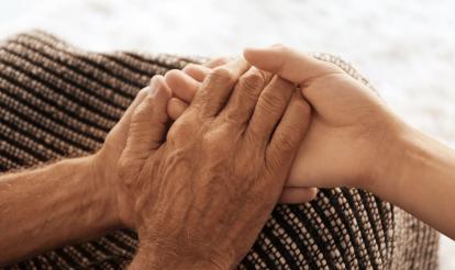 Two people holding hands 