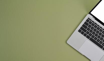 Green background with a laptop 